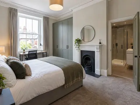 Finished HMO bedroom suite with a feature fireplace and en-suite shower room